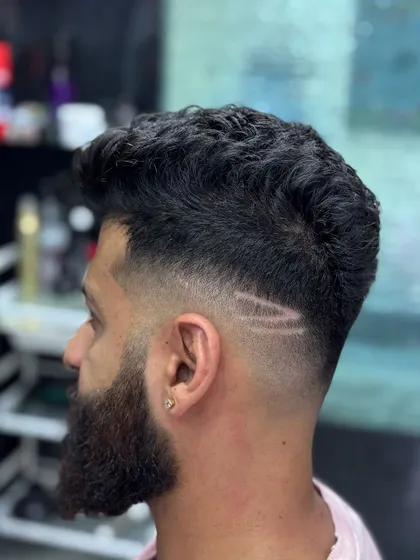 A close-up of a fade with a double line design.