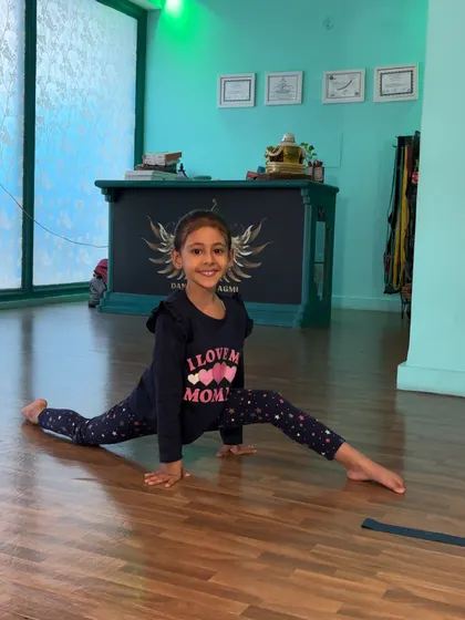 This student's smile says it all. Achieving a split is a huge confidence booster.