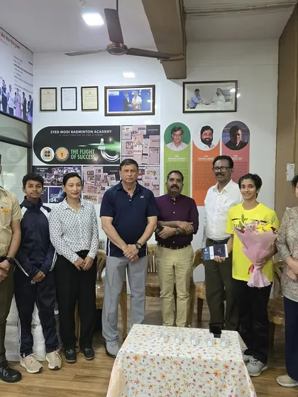 The entire team, including coaches and players, celebrating Malvika Bansod's achievements at a special felicitation ceremony at our academy.