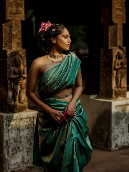 A final look from the 'Thamara' series, showing the versatility of the silk saree, styled here with a different drape and a floral hair accessory.