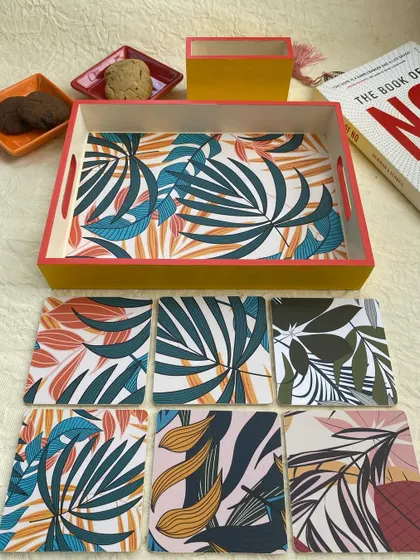 The full set of six coasters is displayed here, showing the variety in the print.