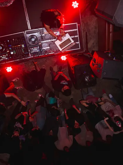 An aerial view of me playing an Ableton set at Khar Social. This perspective shows the connection between the DJ and the crowd, a dynamic we discuss in my workshops on performance and crowd reading.