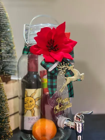 A Sula bottle and decorated drink dispenser appear in our Christmas sangria presentation... alcohol supply arrangements need confirmation for new orders.