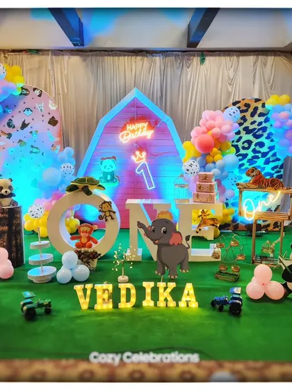 A wider view of the barnyard theme, showing the personalized name and "ONE" marquee letters.