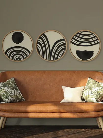 This set of three circular prints features bold, black and white bohemian abstract patterns. The graphic designs create a strong visual impact, perfect for a modern or eclectic space.