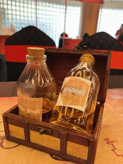 I even created prop potion bottles like 'Amortentia' and 'Draught of Living Death' to place on the tables.