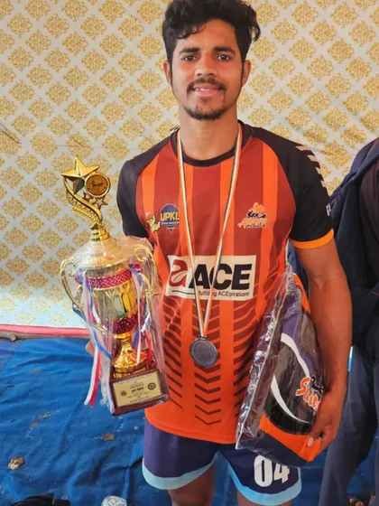 An academy player with his trophy and medal after his selection for the Under-18 National Championship.