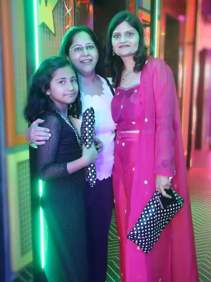 A mother, daughter, and grandmother pose for a three-generation portrait. We love creating these meaningful photos for your family album.