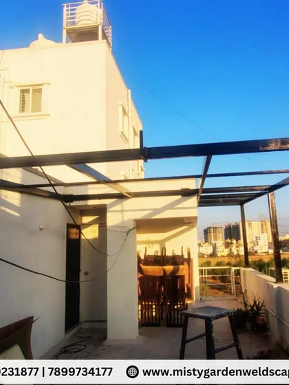 A 30mm puff sheet pergola installed in KR Puram. The heavy-duty metal structure and insulated roofing provide maximum strength and heat protection.