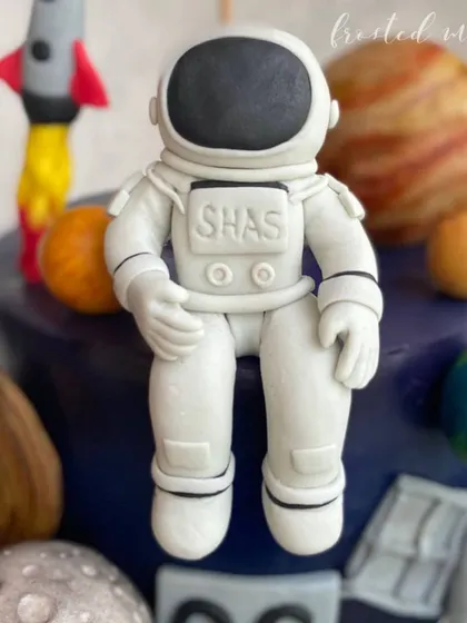 Creating this detailed astronaut figurine was an out-of-this-world experience! Every part of the suit and helmet is hand-shaped and assembled to create a realistic space explorer for a themed birthday cake.
