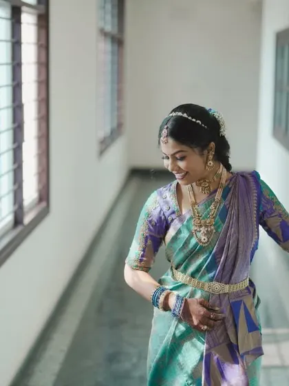 A candid shot of a bride looking out a window, full of anticipation.