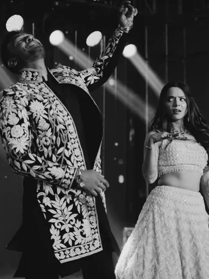 The energy and expression in this black and white photo are just incredible. This is the kind of passion I love to bring out in a couple's sangeet performance.