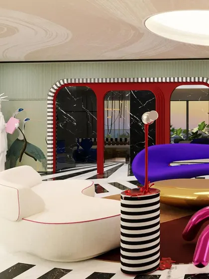 The "Whimsy Wonder" living room features a statue of liberty holding a pink bubblegum, adding a touch of humor and pop art flair to the eclectic space.