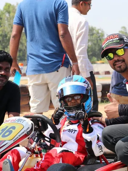 A moment of positive reinforcement on the grid, as our coaches give a thumbs-up to a young driver.