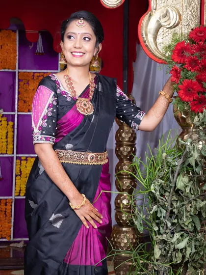 A happy client at a family function. The simple long necklace with a statement pendant is an easy way to dress up any traditional outfit.