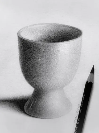 A study of a small ceramic cup. This exercise focuses on capturing the subtle curves and smooth finish of a ceramic object.