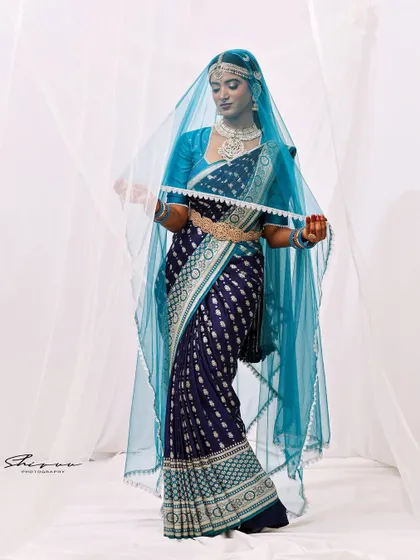 Another beautiful shot with the veil, this time capturing a more dynamic pose that shows the flow and movement of the fabric.