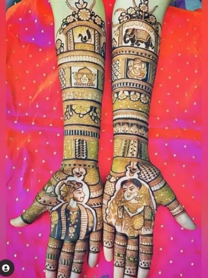 This elaborate design features bride and groom portraits on the palms, with stories from their life depicted up the arms, including elephants and architectural elements.