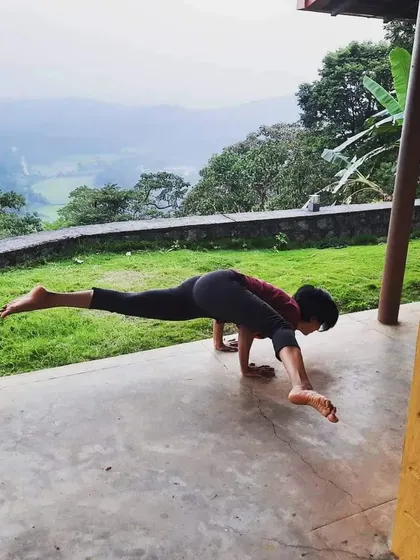 Eka Pada Koundinyasana II, an advanced arm balance that combines a twist and a leg extension. This pose requires a lot of core and upper body strength, showing what is possible with consistent practice.