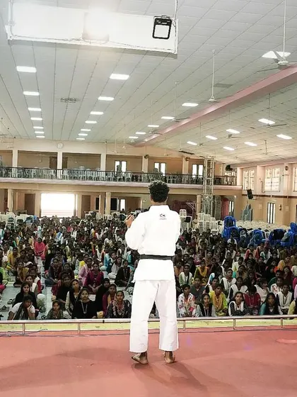 This is the view from the stage during a women's safety workshop. My team and I demonstrate each technique clearly so the large audience can see, understand, and then practice the moves themselves.