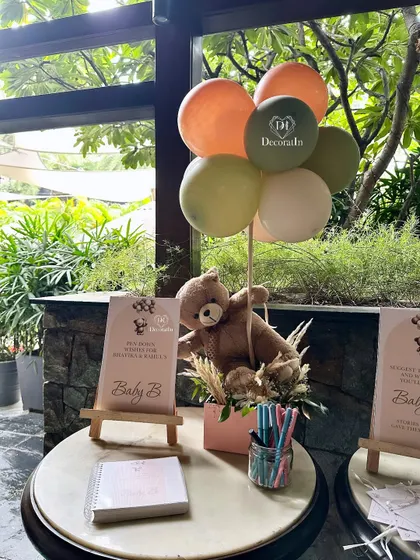 The wishes station, complete with a teddy bear centerpiece, set against a lovely window view.