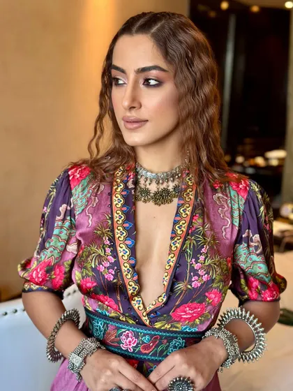 This profile shot highlights the seamless blend of the eye makeup and the subtle contouring. The goal was to create a look that felt glamorous yet effortless, perfect for a contemporary fashion brand.