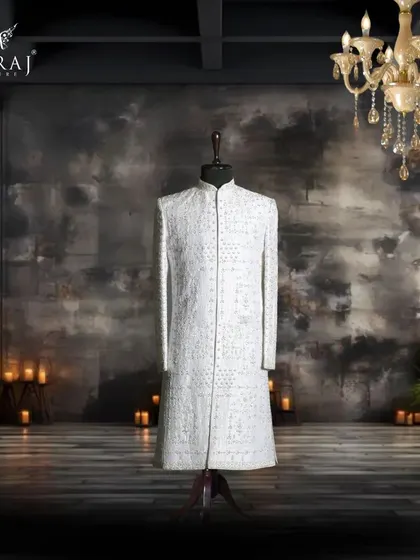 This off-white sherwani is designed for quiet sophistication. The delicate, Persian-inspired embellishments are carefully placed to create a look of timeless artistry and grace.