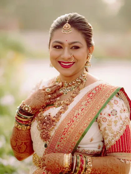 A happy bride. This close-up shows the beautiful smile of Deekshitha, whose bridal look was completed with one of my custom-designed blouses.