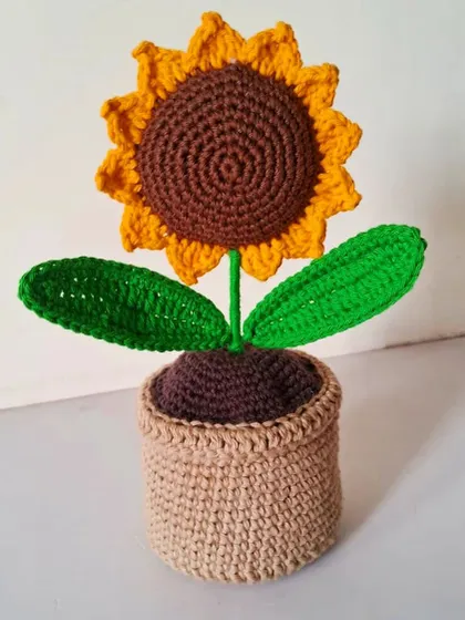 Here is my crochet sunflower in a pot, a perfect little gift or a cute accessory for your car dashboard. It's handmade sunshine that you can take anywhere.