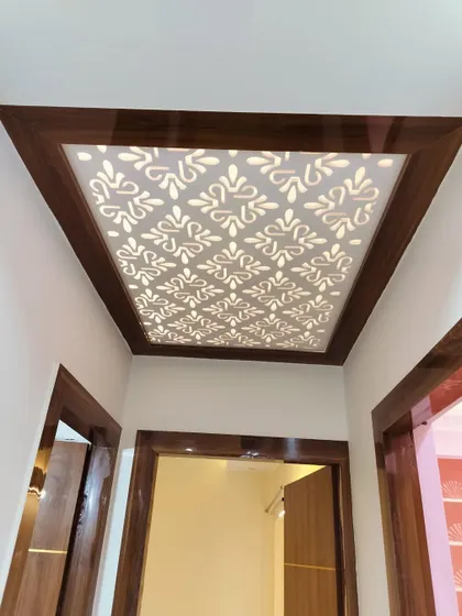 A close-up of the backlit CNC jali panel in the foyer ceiling. This is a great way to add a decorative lighting element to your entrance area.