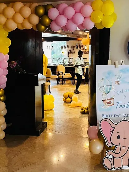 This baby elephant themed entrance is adorable and inviting. A custom welcome board with a cute elephant graphic is paired with a colorful balloon arch to welcome guests.