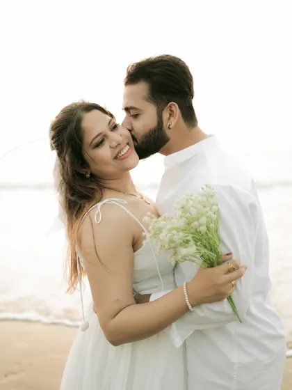 A sweet kiss on the cheek with the ocean waves in the background. These are the simple, affectionate gestures I love to capture.