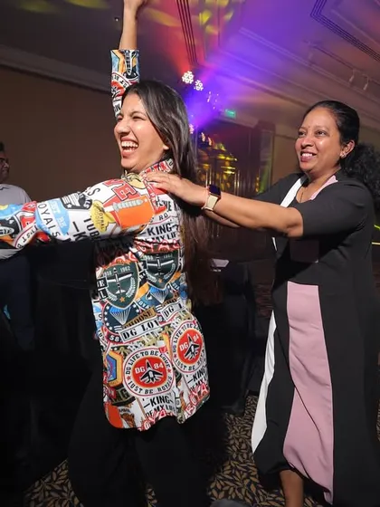 The party doesn't stop on the stage. Here I am dancing with attendees, making sure the celebratory vibe is felt throughout the entire venue.