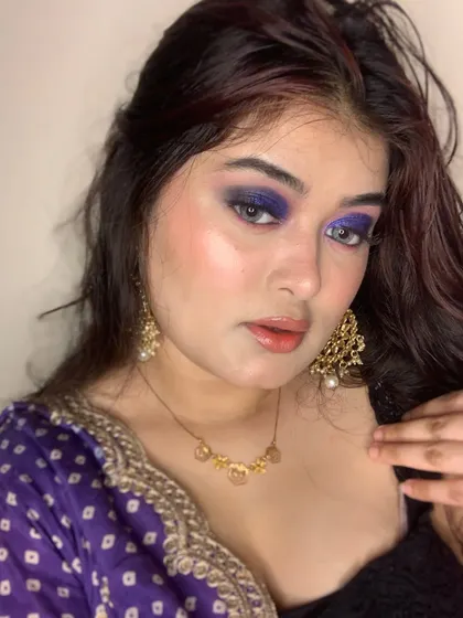 Another angle of the purple smokey eye, paired with a glossy lip.