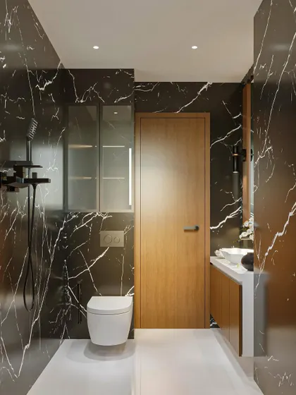 Another view of the bold black marble bathroom. This shot highlights the spacious layout, the wooden door that adds warmth, and the sleek, modern fixtures that complete the high-end look.