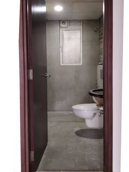 Before shot of the moody bathroom.