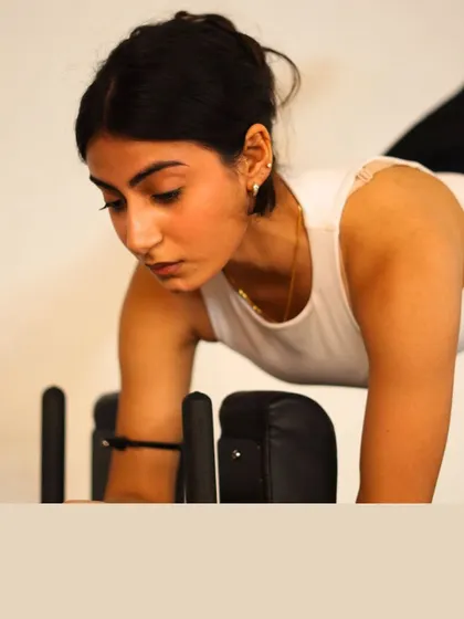 A close-up on focus. Pilates begins with connecting your mind to your breath and movement.