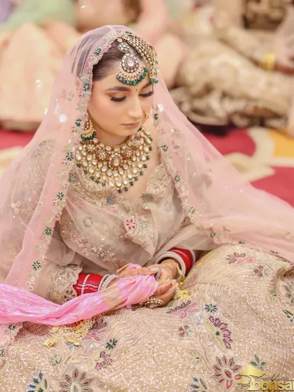 The bride during the Anand Karaj ceremony, a moment of quiet contemplation and prayer.