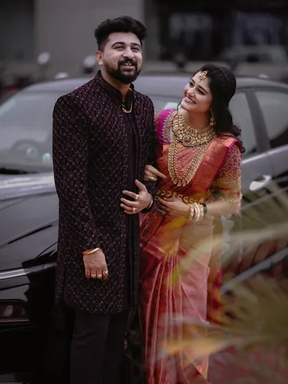 A classic portrait of the couple by a car. Her admiring glance at him creates a sweet and story-driven image.