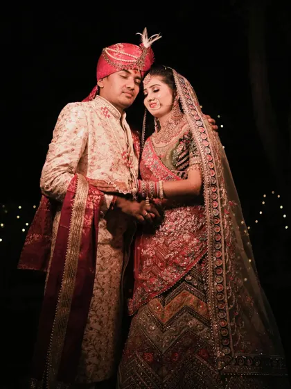 A classic portrait of the couple holding each other close, a timeless representation of their union.