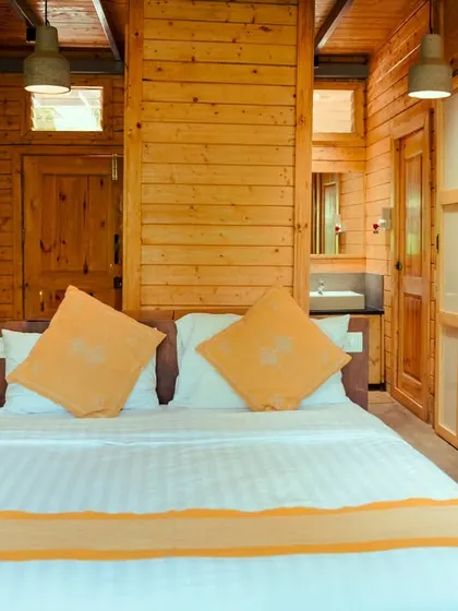The simple and warm design of our wooden cabins ensures a peaceful and restful night's sleep.