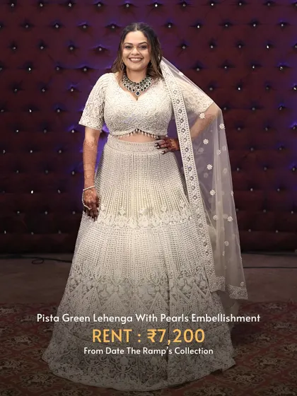 A beautiful pista green lehenga with delicate pearl embellishments. A sophisticated and unique choice for a wedding guest.