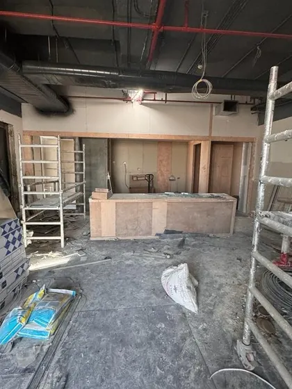 The bar and pantry area under construction at the Carlsberg office. The basic form of the counter is in place, giving a sense of the future social hub where employees will gather and connect.