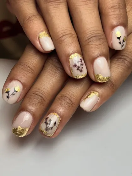 Luxurious and glamorous, this design is perfect for special occasions or everyday wear. It features real dried flowers and delicate gold foil accents on a milky white base.