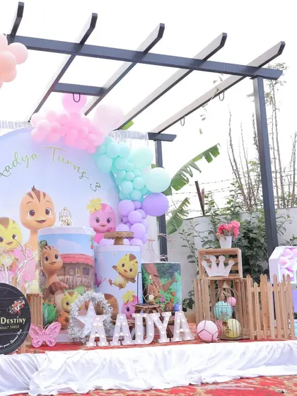 A wide shot of our Katuri-themed outdoor setup. The circular backdrop and pastel balloon clusters create a beautiful focal point for the party.