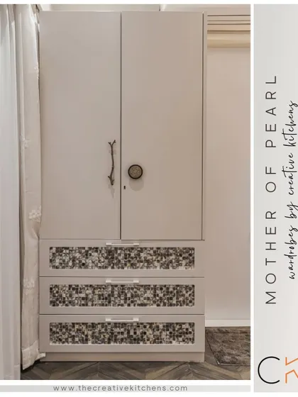 A full view of the "Mother of Pearl" wardrobe, showcasing its unique combination of textures and finishes. It's a perfect example of how we blend functionality with artistry.