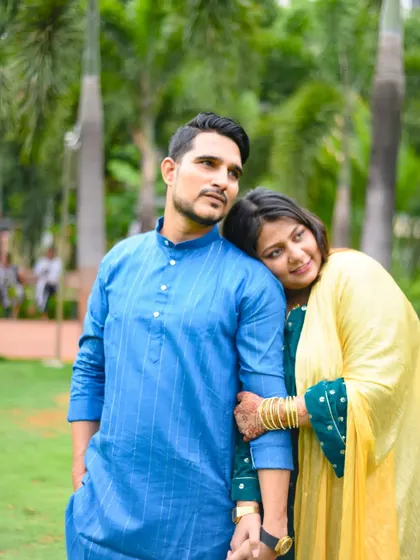 A romantic pose with the woman resting her head on her partner's shoulder. A classic and tender shot for any couple's album.