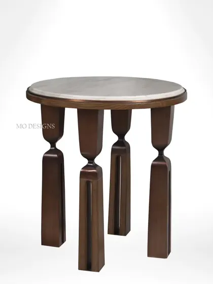 A studio shot of the shagreen and brass side table. The four uniquely shaped legs provide a stable and visually interesting base for the luxurious round top, making it perfect for a living room, entryway, or bedroom.