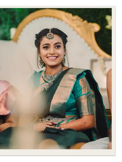 A radiant bride smiling during her ceremony, a perfect candid shot.