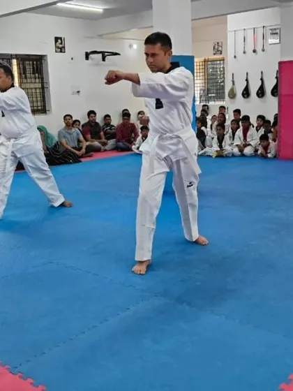 The two senior students execute a punch.